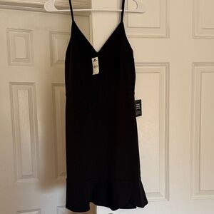 Express Black Dress with Ruffle Hem